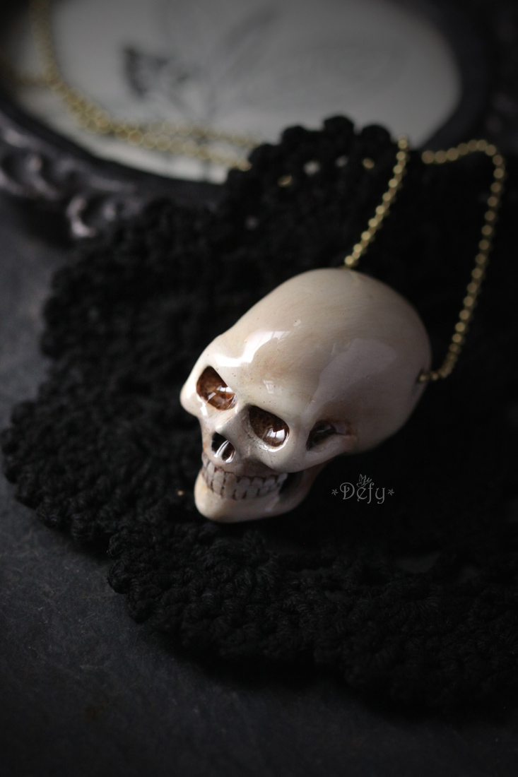 Human skull store necklace